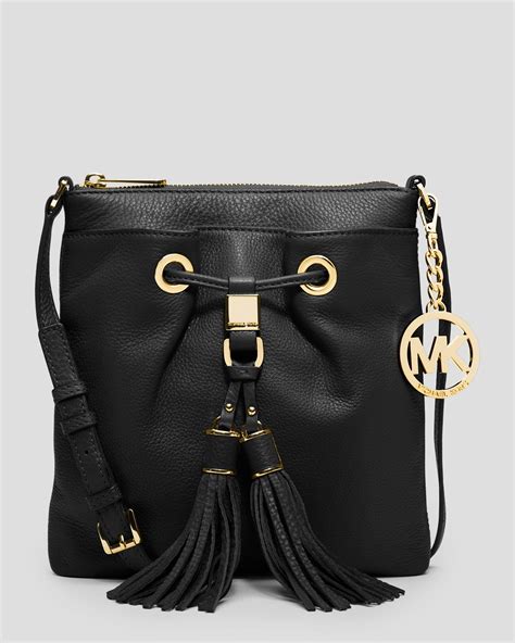 michael kors black crossbody grommets tassel|Michael Kors Crossbody purse.